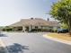 The community clubhouse features manicured landscaping, a circular driveway, and ample parking at 2905 Pluton Pl, Rolesville, NC 27571