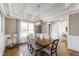 Elegant dining room with a coffered ceiling, a stylish chandelier, and seating for six at 2905 Pluton Pl, Rolesville, NC 27571