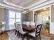 Traditional dining room features hardwood floors, stylish furnishings, and bright natural light at 2905 Pluton Pl, Rolesville, NC 27571
