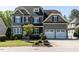 Charming two-story home with a neatly maintained lawn and attached two-car garage at 2905 Pluton Pl, Rolesville, NC 27571