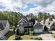 Beautiful two-story home nestled on a tree-lined street, showcasing a spacious yard and attached garage at 2905 Pluton Pl, Rolesville, NC 27571