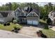 Stunning home featuring a two-car garage, meticulously maintained landscaping, and a spacious driveway at 2905 Pluton Pl, Rolesville, NC 27571