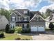 Charming two-story home features a well-manicured lawn, attached two-car garage, and lovely curb appeal at 2905 Pluton Pl, Rolesville, NC 27571