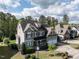 Beautiful home showcasing gray siding, a two-car garage, and manicured landscaping, situated in a lovely neighborhood at 2905 Pluton Pl, Rolesville, NC 27571