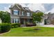 Charming two-story home featuring stone accents, shuttered windows, and a beautifully landscaped front yard at 2905 Pluton Pl, Rolesville, NC 27571