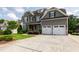 Beautiful home with an attached garage, well-manicured lawn, and a long driveway for ample parking at 2905 Pluton Pl, Rolesville, NC 27571