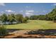 A well-manicured golf course provides a serene backdrop for this beautiful community at 2905 Pluton Pl, Rolesville, NC 27571
