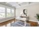 Bright home office with natural light, hardwood floors, and a comfortable workspace at 2905 Pluton Pl, Rolesville, NC 27571