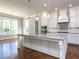 Gourmet kitchen featuring a granite island, stainless appliances, and bright, open layout at 2905 Pluton Pl, Rolesville, NC 27571