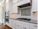 Modern kitchen featuring white cabinets, granite counters, stainless appliances and mosaic backsplash at 2905 Pluton Pl, Rolesville, NC 27571