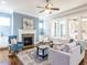 Inviting living room boasts a fireplace, built-in cabinets, and large windows at 2905 Pluton Pl, Rolesville, NC 27571