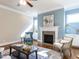 Cozy living room with a fireplace, refined furniture, and stylish decor at 2905 Pluton Pl, Rolesville, NC 27571