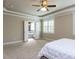 Bedroom with ensuite bathroom, neutral colors, and large windows at 2905 Pluton Pl, Rolesville, NC 27571