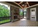 Screened porch with stone fireplace at 2905 Pluton Pl, Rolesville, NC 27571
