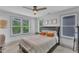 Serene bedroom with a comfortable bed, ceiling fan, and abundant natural light, creating a restful retreat at 3 Maple St, Raleigh, NC 27610