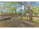 Backyard contains a wooden deck, a green yard, and a shed with wooden fence at 3 Maple St, Raleigh, NC 27610