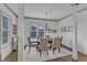 Bright dining room with a wooden table, seating for six, and natural light at 3 Maple St, Raleigh, NC 27610