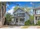 Charming two-story home with a welcoming porch and a bright yellow front door at 3 Maple St, Raleigh, NC 27610