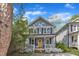 Charming two-story home with a welcoming porch and a bright yellow front door at 3 Maple St, Raleigh, NC 27610