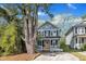 Charming two-story home with a welcoming porch and a bright yellow front door at 3 Maple St, Raleigh, NC 27610