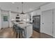 Modern kitchen with a large island, stainless steel appliances, and white cabinetry at 3 Maple St, Raleigh, NC 27610