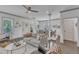 Open-concept living room and dining area with modern furnishings and hardwood floors at 3 Maple St, Raleigh, NC 27610