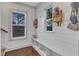 Bright mudroom features white shiplap, storage cubbies, and wood floors, a practical and stylish entryway at 3 Maple St, Raleigh, NC 27610