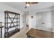 Comfortable office space with a large bookshelf, ceiling fan and neutral carpet, a perfect workspace at 3 Maple St, Raleigh, NC 27610
