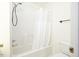 Bathroom features a tub with shower at 300 Round About Rd, Holly Springs, NC 27540