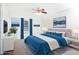 Bright bedroom featuring neutral walls, blue accents, and natural light from a window for a relaxing ambiance at 300 Round About Rd, Holly Springs, NC 27540