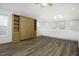 A versatile bonus room with built-in cabinets and a Murphy bed offers both functionality and style at 300 Round About Rd, Holly Springs, NC 27540