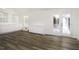 Bonus room with wood flooring, built-in cabinets, and bright windows offers versatility and charm at 300 Round About Rd, Holly Springs, NC 27540