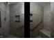 Modern shower features sleek tile work, built-in shelving, and grab bars for enhanced safety and style at 300 Round About Rd, Holly Springs, NC 27540