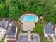 Aerial view of community pool, showing proximity to the clubhouse and neighborhood homes at 307 Parkmeadow Dr, Cary, NC 27519