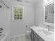 This bathroom features a combination shower and tub, as well as single sink vanity at 307 Parkmeadow Dr, Cary, NC 27519