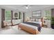 Stylish bedroom featuring a sleek bed, modern furniture, and windows that provide ample natural light at 307 Parkmeadow Dr, Cary, NC 27519