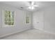 This bedroom features neutral walls, a ceiling fan and a closet at 307 Parkmeadow Dr, Cary, NC 27519