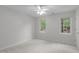 Neutral bedroom with plenty of natural light, carpet flooring, and standard wall trim at 307 Parkmeadow Dr, Cary, NC 27519