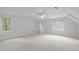 This empty bedroom has neutral walls, carpeted floor, and a ceiling fan at 307 Parkmeadow Dr, Cary, NC 27519