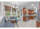Bright eating area with built-in banquette seating, a glass table, and ample natural light at 307 Parkmeadow Dr, Cary, NC 27519