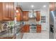 Well-equipped kitchen featuring custom cabinets, granite countertops, and stainless steel appliances at 307 Parkmeadow Dr, Cary, NC 27519