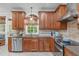 Updated kitchen with custom cabinetry, granite countertops, stainless steel appliances, and natural light at 307 Parkmeadow Dr, Cary, NC 27519