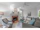 Inviting living room featuring a brick fireplace, neutral tones, and stylish decor at 307 Parkmeadow Dr, Cary, NC 27519