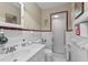 Cozy bathroom with white tile, walk-in shower, and updated fixtures at 310 Edward Ln, Louisburg, NC 27549