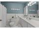 Traditional bathroom featuring white fixtures, coordinating white tiles, and white wall paint at 310 Edward Ln, Louisburg, NC 27549
