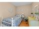 Bright bedroom featuring hardwood floors and sunny window with charming decor at 310 Edward Ln, Louisburg, NC 27549