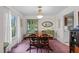 Formal dining room with a wooden table, six chairs, a green china cabinet, and natural light at 310 Edward Ln, Louisburg, NC 27549