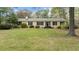 Charming single-story home with symmetrical design, black shutters, and a green front lawn at 310 Edward Ln, Louisburg, NC 27549