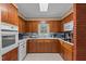 Traditional kitchen with wood cabinets and modern appliances, including built-in oven at 310 Edward Ln, Louisburg, NC 27549