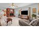 Inviting living room featuring a cozy fireplace, tile flooring, and comfortable seating at 310 Edward Ln, Louisburg, NC 27549